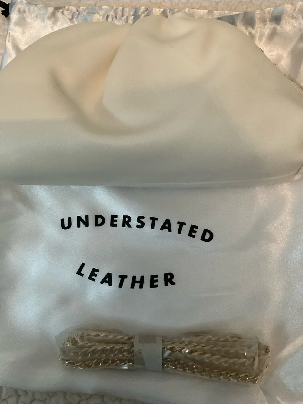 Understated Leather crescent cream